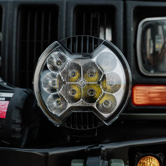 compare product KC HiLiTES SlimLite 6in Light Shield - SAE Driving Beam - Clear