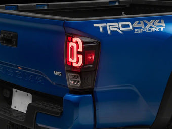 compare product Raxiom 16-23 Toyota Tacoma XW Series Sequential LED Tail Lights- Black Housing- Clear Lens