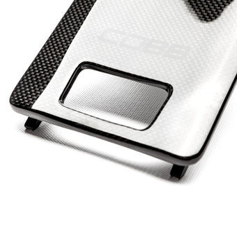 compare product Cobb Porsche Carbon Fiber Fuse Cover - Driver Side