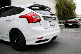 compare product Seibon 12-13 Ford Focus 4 Door Carbon Fiber Tail Garnish