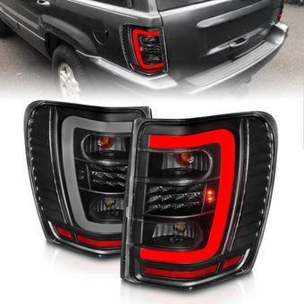 compare product ANZO 1999-2004 Jeep Grand Cherokee LED Tail Lights w/ Light Bar Black Housing Clear Lens