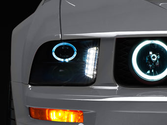 compare product Raxiom 05-09 Ford Mustang w/ Halogen LED Halo Prjctr Headlights-Blk Hsng(Smoked Lens Exclude GT500)