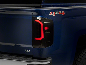 compare product Raxiom 14-18 Chevrolet Silverado 1500 Axial Series LED Tail Lights- Black Housing (Smoked Lens)