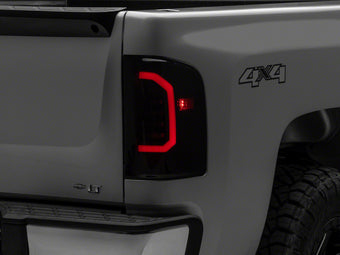 compare product Raxiom 07-14 Chevrolet Silverado 1500 Axial Series LED Tail Lights- Black Housing (Smoked Lens)