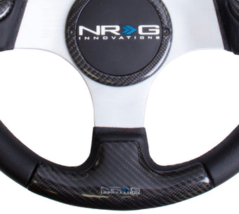 compare product NRG Carbon Fiber Steering Wheel (350mm) Silver Frame Blk Stitching w/Rubber Cover Horn Button