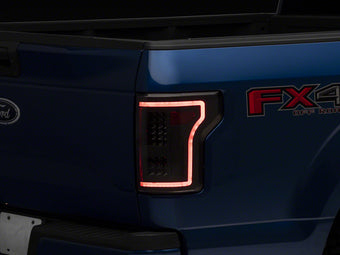 compare product Raxiom 15-17 Ford F-150 LED Tail Lights w/ SEQL Turn Signals- Black Housing (Clear Lens)