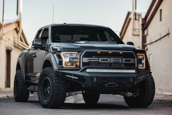 compare product Addictive Desert Designs 17-18 Ford F-150 Raptor HoneyBadger Front Bumper w/ Winch Mount