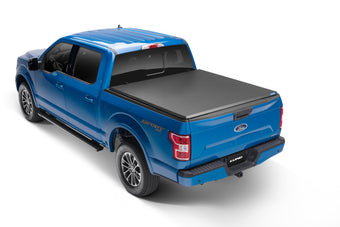 compare product Lund 09-14 Ford F-150 Styleside (5.5ft. Bed) Hard Fold Tonneau Cover - Black