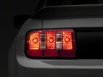 compare product Raxiom 05-09 Ford Mustang Coyote Tail Lights- Chrome Housing - Red/Clear Lens