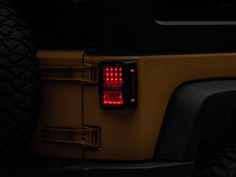 compare product Raxiom 07-18 Jeep Wrangler JK Axial Series Lux LED Tail Lights- Black Housing (Clear Lens)