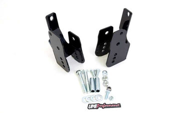 compare product UMI Performance 05-14 Ford Mustang Rear Control Arm Relocation Brackets- Bolt In